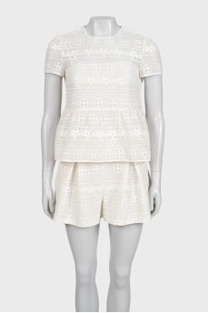 White suit with shorts, a T-shirt and a blouse