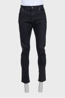 Men's black tapered fit jeans with buttons
