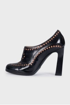 Black leather shoes with perforations