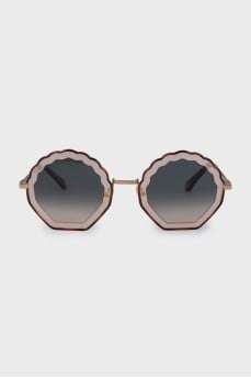 Sunglasses with shaped lenses