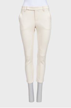 White tapered trousers with a mid-rise