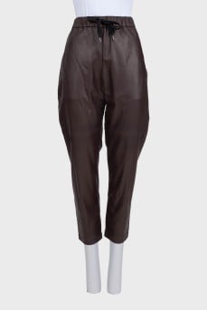 Brown leather trousers with tag
