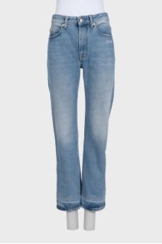 Light blue jeans with a distressed effect