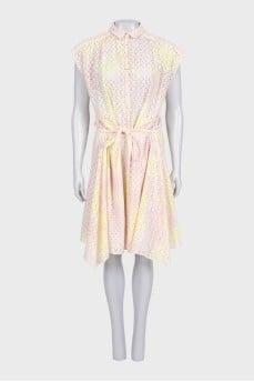 The pink dress is decorated with perforations