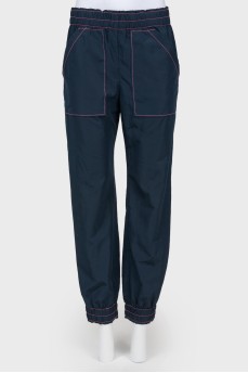 Blue pants with a pink line