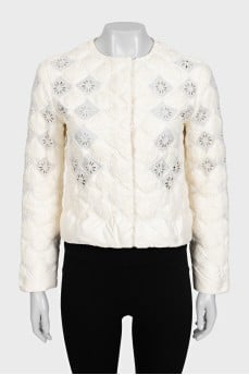 Straight jacket decorated with perforations