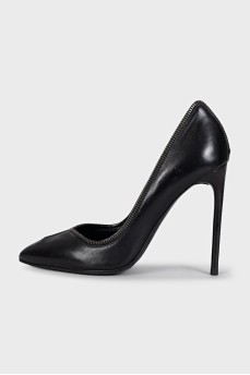 Black leather shoes decorated with a zipper