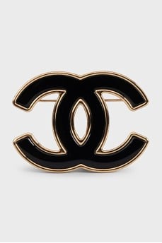 Brooch in the form of a company logo