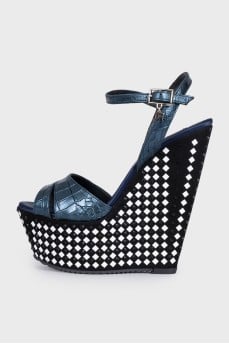 Sandals with a high decorated wedge heel
