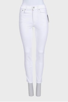 Mid-rise skinny jeans with tag