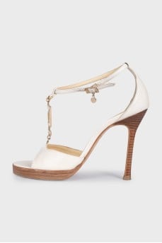 White leather sandals with decor