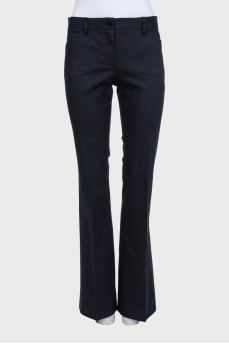 Black flared trousers with a mid-rise