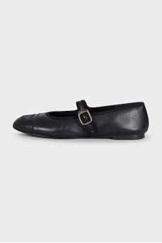Black leather ballet flats with signature embroidery