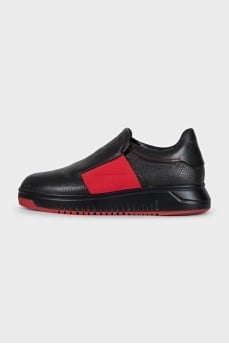 Men's black loafers with red accents