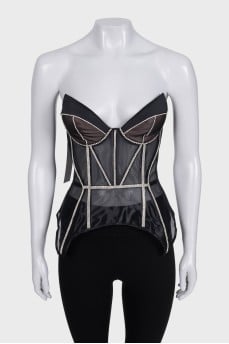 Black corset decorated with rhinestones with a tag