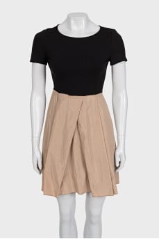 Black fitted dress with beige hem