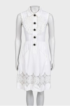 White fitted dress decorated with perforations
