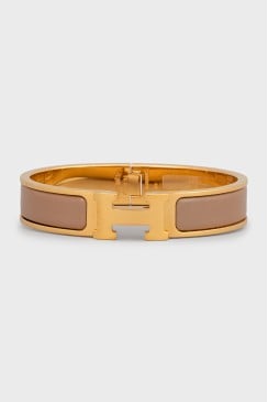 Браслет золотистого кольору Clic H