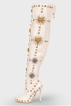Beige boots with metal jewelry