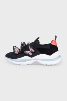 Black sneakers decorated with butterflies