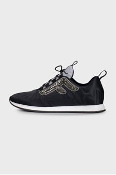 Black sneakers decorated with rhinestones