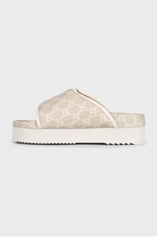 Beige canvas slides with tag