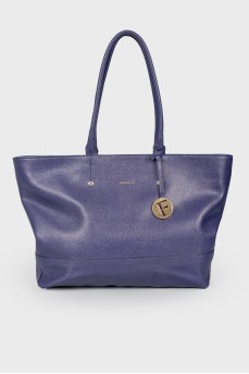 Wide leather bag of indigo color