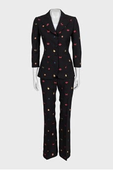 Black suit with trousers decorated with embroidery