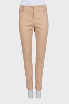 Beige tapered trousers with creases at the front