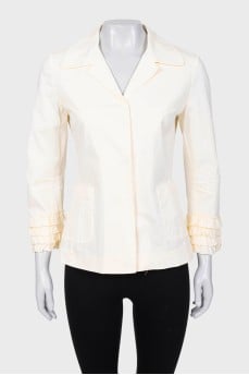 Yellow jacket with ruffles on the sleeves