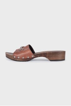 Leather clogs with wooden soles