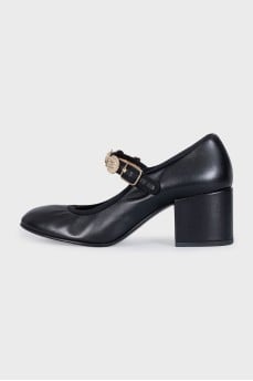 Black high heels with gold trim
