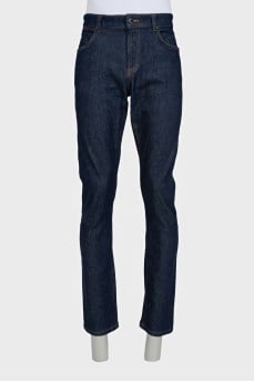 Men's dark blue straight leg jeans with a button