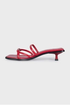 Red leather mules with heels and tag