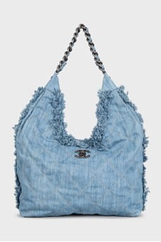 Denim bag decorated with fringe