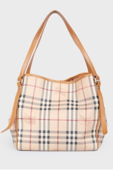 Brown leather bag of a trapezoid shape