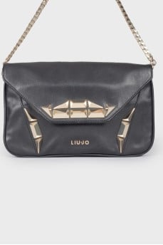 Leather bag with metal decor