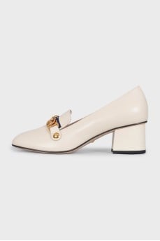 White leather shoes with gold decor