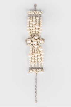 Pearl bracelet with a cross
