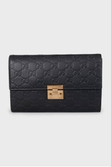 Black leather clutch with embossing
