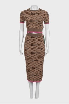 Brown skirt suit with branded print and tag