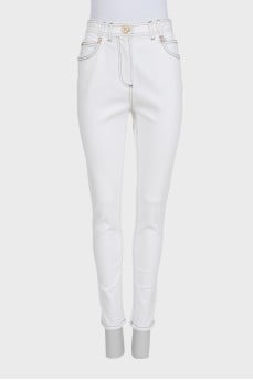 White tapered jeans with black piping