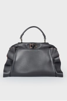Leather bag with peekaboo frills