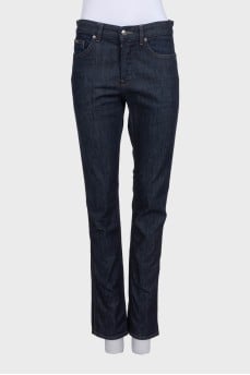 Dark blue straight-leg jeans with a button