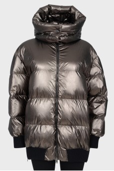 Short green down jacket with a tag