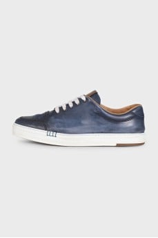 Men's dark blue sneakers feature perforations on the toe
