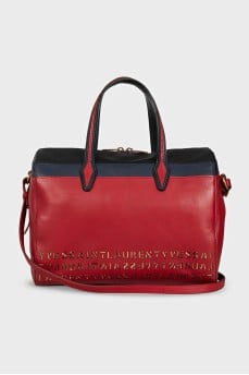 Red leather tote bag decorated with perforations
