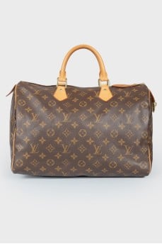 Speedy brown leather bag with branded brand coloring
