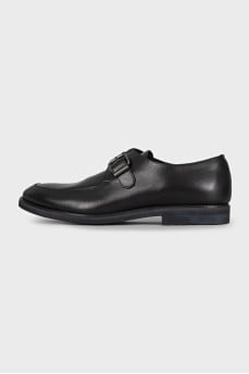 Men's black leather shoes with a buckle