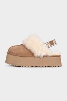 Brown insulated UGG boots with elastic